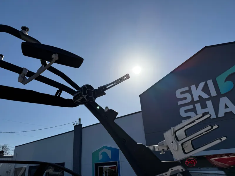 Slide: The Image of 2021 Malibu Wakesetter 23 LSV boat tower against sunny sky at Ski Shack. - 22