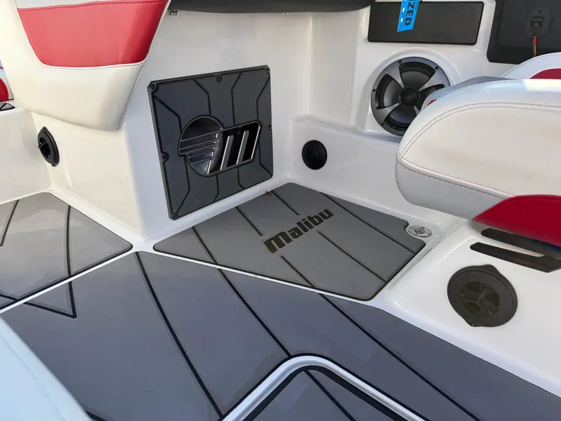 Slide: The Image of Interior of 2021 Malibu Wakesetter 23 LSV boat with red and gray seating. - 26