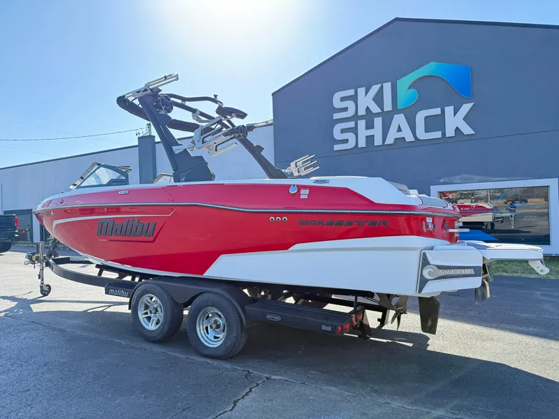 Slide: The Image of 2021 Malibu Wakesetter 23 LSV boat in red and white at Ski Shack dealership. - 7