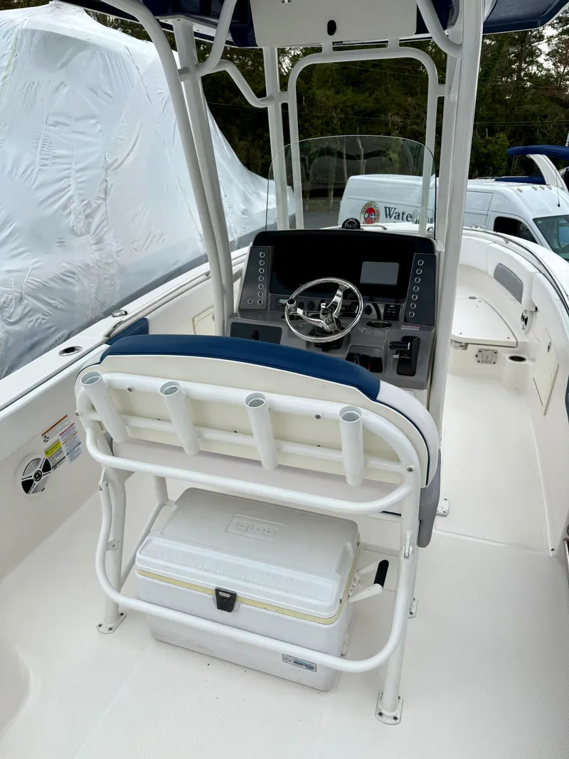 Slide: The Image of 2020 Robalo R242 Explorer boat cockpit with steering wheel and seating. - 23