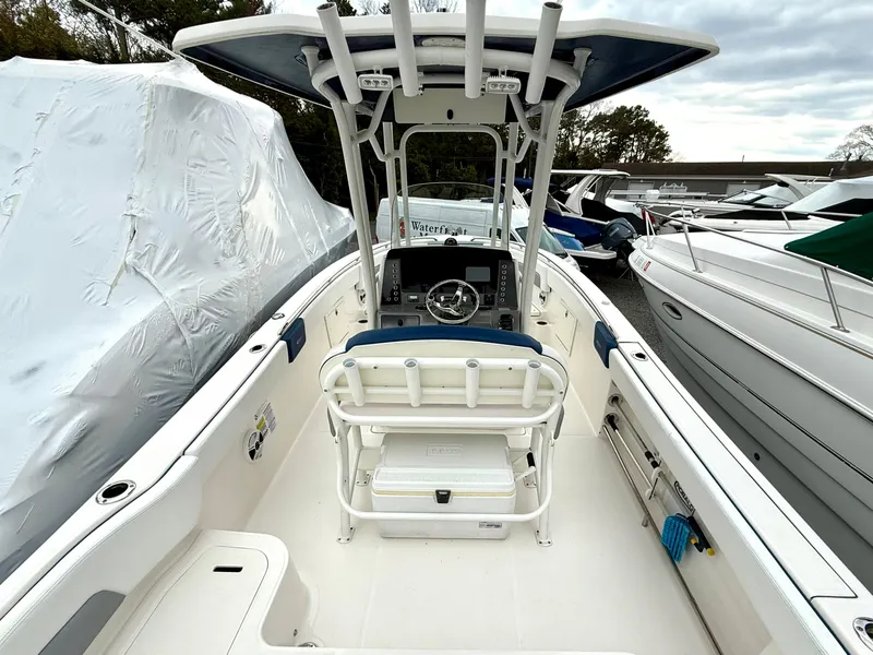 Slide: The Image of 2020 Robalo R242 Explorer boat interior with helm, seating, and storage. - 24