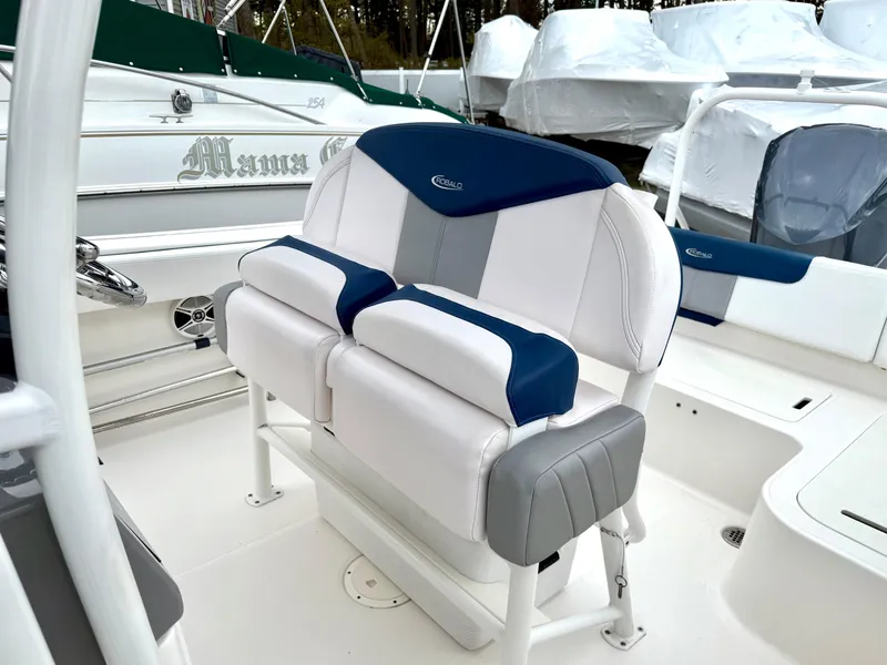 Slide: The Image of 2020 Robalo R242 Explorer boat seating with blue and white upholstery. - 25