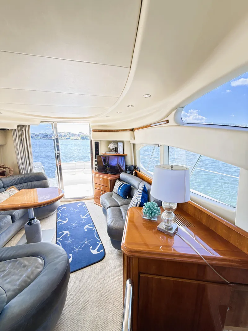 Slide: The Image of Luxurious interior of a 2002 Azimut 42 yacht with elegant furnishings and ocean view. - 13