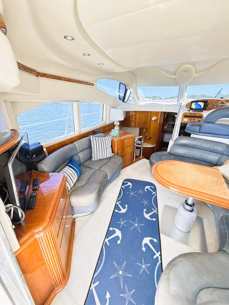 Slide: The Image of Luxurious interior of a 2002 Azimut 42 yacht with elegant seating and nautical decor. - 14