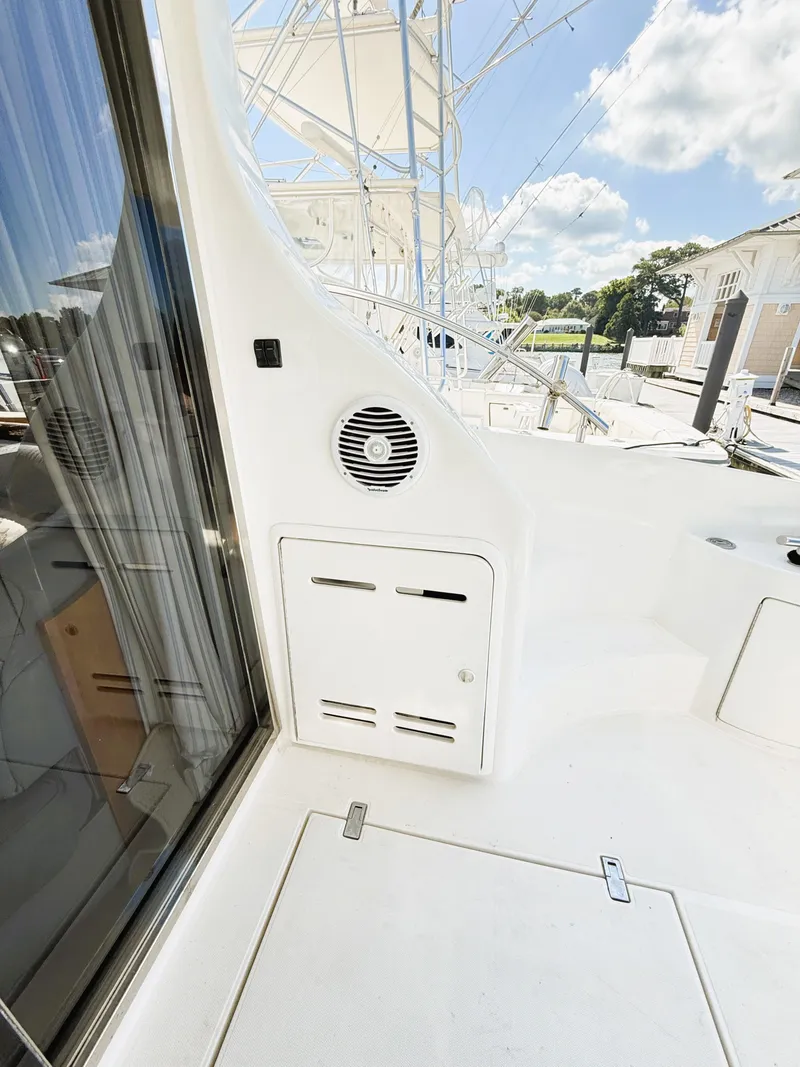 Slide: The Image of 2002 Azimut 42 yacht deck with speaker and storage compartment. - 35