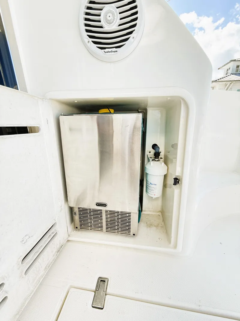 Slide: The Image of 2002 Azimut 42 yacht interior with stainless steel appliance and speaker. - 38