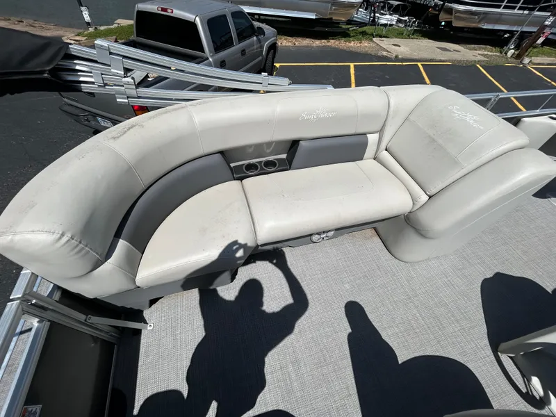 Slide: The Image of 2020 SunChaser Vista 18 Fish boat interior with beige seating and cup holders. - 10