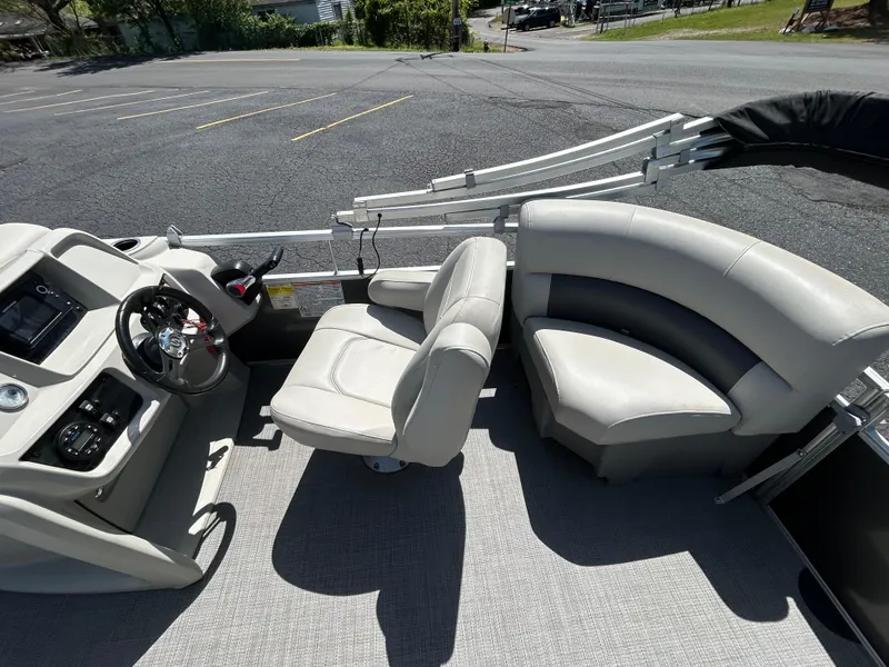 Slide: The Image of 2020 SunChaser Vista 18 Fish boat interior with steering console and seating. - 11
