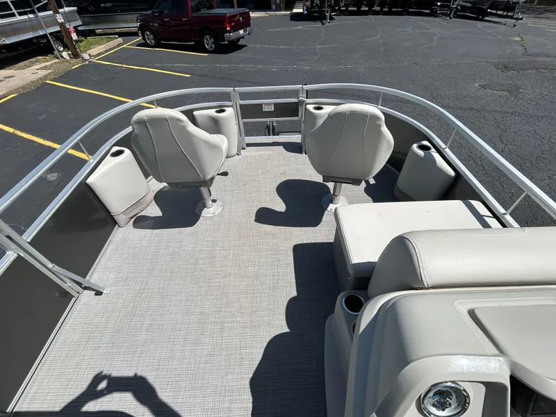 Slide: The Image of 2020 SunChaser Vista 18 Fish pontoon boat interior with seating and cup holders. - 12