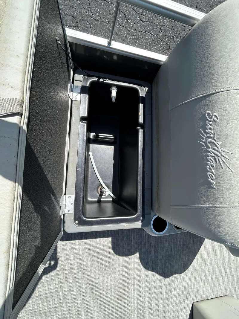 Slide: The Image of 2020 SunChaser Vista 18 Fish boat seat with storage compartment open. - 14