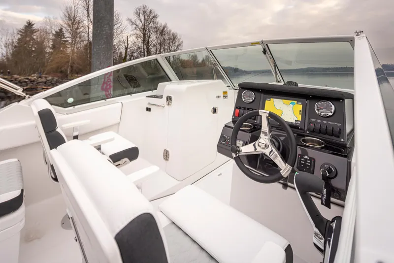 Slide: The Image of 2024 Blackfin 232DC Dual Console boat interior with modern dashboard and seating. - 14