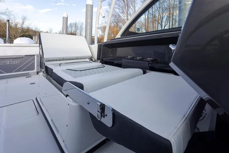 Slide: The Image of 2024 Blackfin 252 DC boat interior with adjustable seating and sleek design. - 17