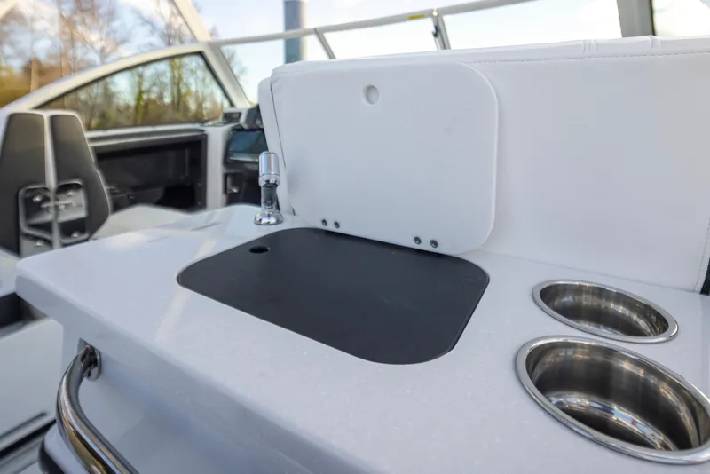 Slide: The Image of 2024 Blackfin 252 DC boat interior with sink and cup holders. - 21