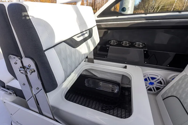 Slide: The Image of 2024 Blackfin 252 DC boat interior with seating and storage compartment. - 28