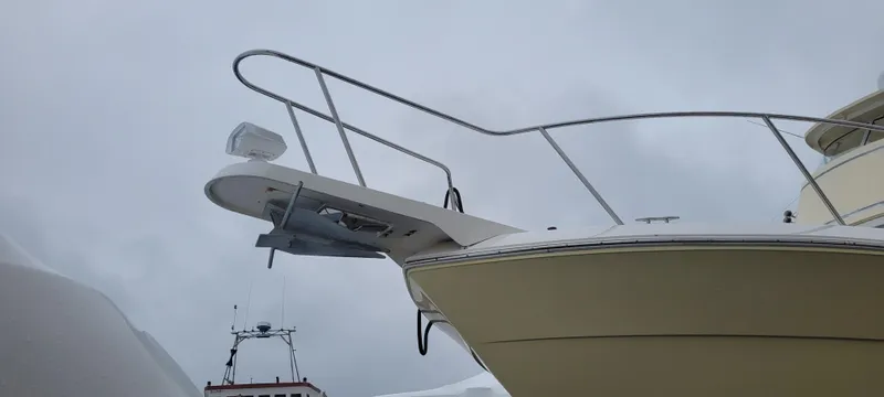 Slide: The Image of 2006 Wellcraft 330 Coastal boat bow against cloudy sky. - 19
