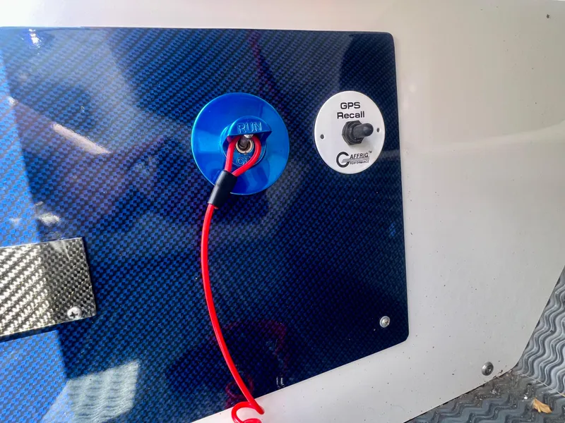 Slide: The Image of Carbon fiber panel with GPS recall switch and blue connector, Skater 32B, 2001 model. - 16