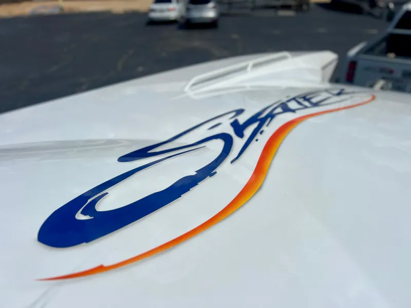 Slide: The Image of Close-up of Skater 32B boat logo, 2001 model, on a white surface. - 37