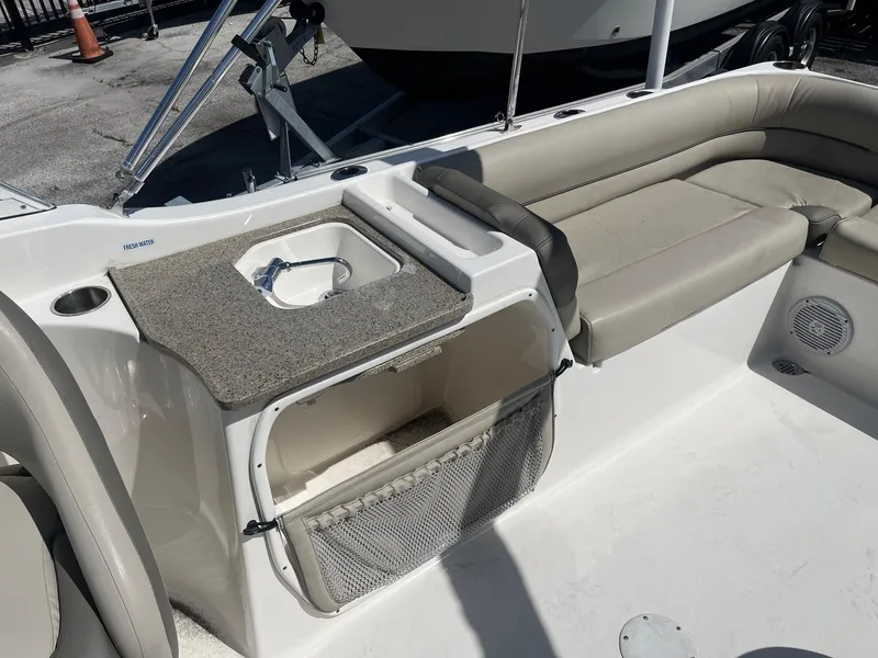 Slide: The Image of 2022 Key West 239 DFS boat interior with seating and storage area. - 5