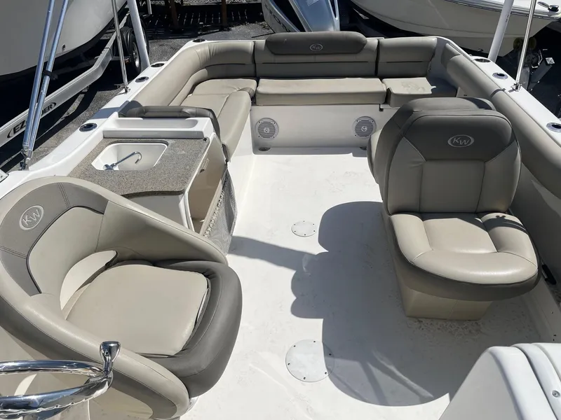 Slide: The Image of 2022 Key West 239 DFS boat interior with beige seating and spacious layout. - 6