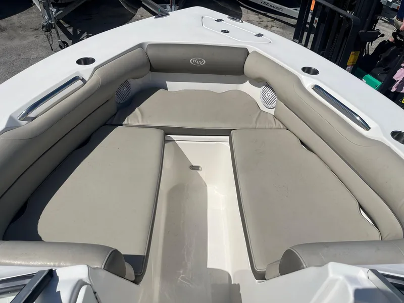 Slide: The Image of 2022 Key West 239 DFS boat interior with cushioned seating and speakers. - 7