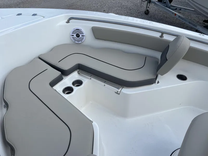 Slide: The Image of 2025 Key West 203 FS boat interior with cushioned seating and cup holders. - 14