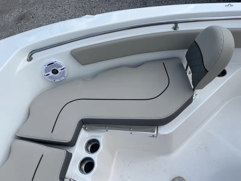 Slide: The Image of 2025 Key West 203 FS boat interior with cushioned seating and speaker. - 15