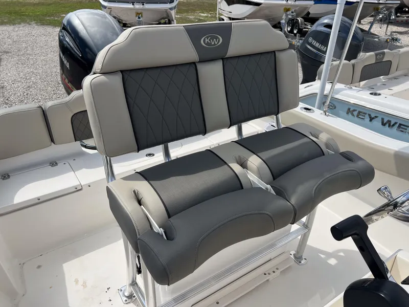 Slide: The Image of 2025 Key West 203 FS boat seats with gray and black upholstery. - 8