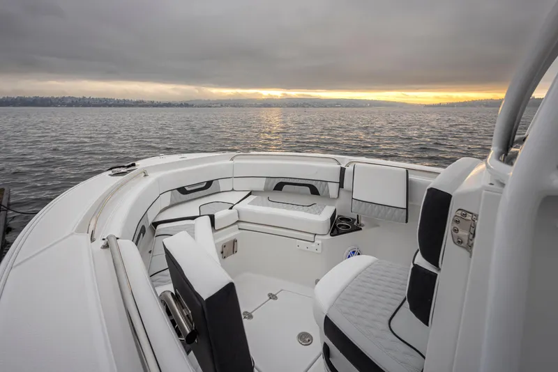 Slide: The Image of 2024 Blackfin 222 CC boat interior with sunset over water. - 20