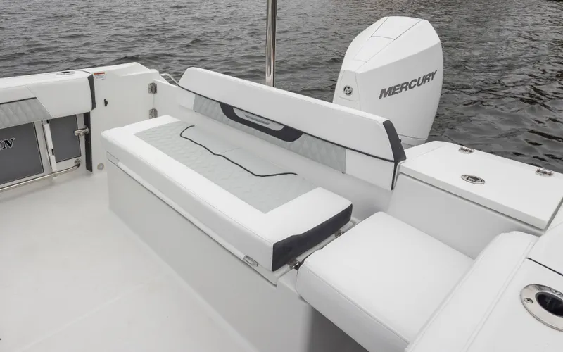 Slide: The Image of 2024 Blackfin 222 CC boat interior with white seating and Mercury engine. - 31
