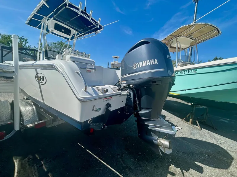 Slide: The Image of 2018 Sea Hunt Triton 225 boat with Yamaha outboard motor on a trailer. - 5