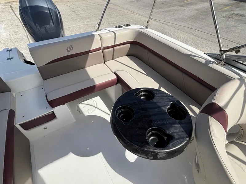 Slide: The Image of 2019 Hurricane SD217 boat interior with seating and cup holder table. - 19