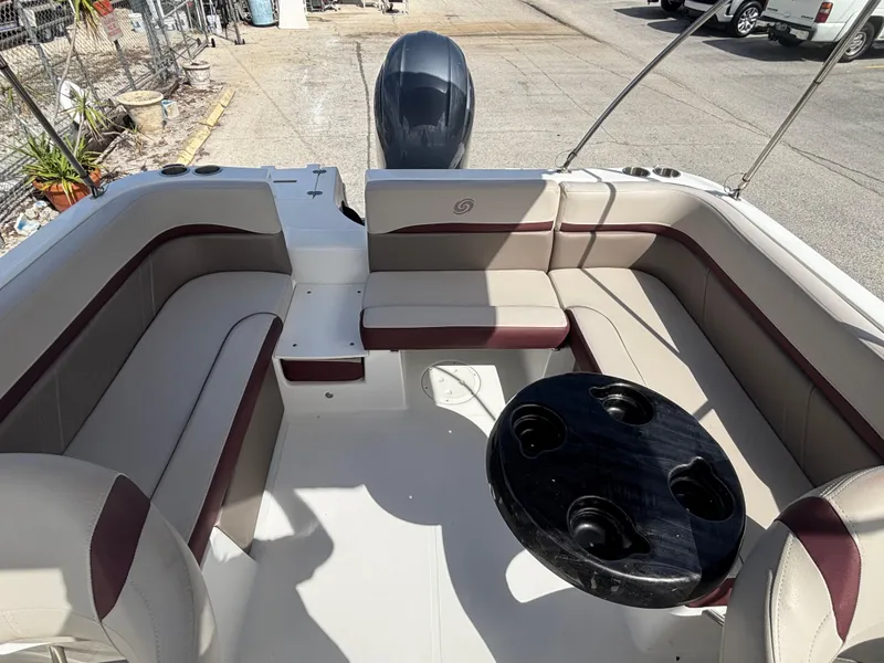 Slide: The Image of 2019 Hurricane SD217 boat interior with beige seating and black table. - 20