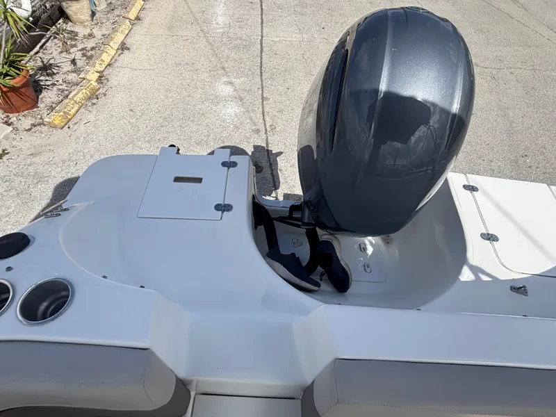 Slide: The Image of 2019 Hurricane SD217 boat with outboard motor on a concrete surface. - 23