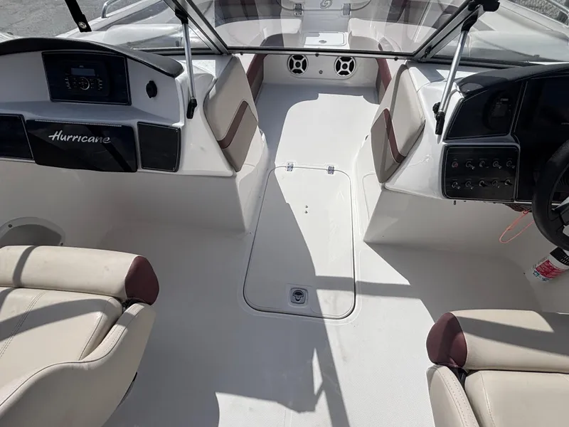 Slide: The Image of 2019 Hurricane SD217 boat interior with beige seating and modern dashboard. - 26