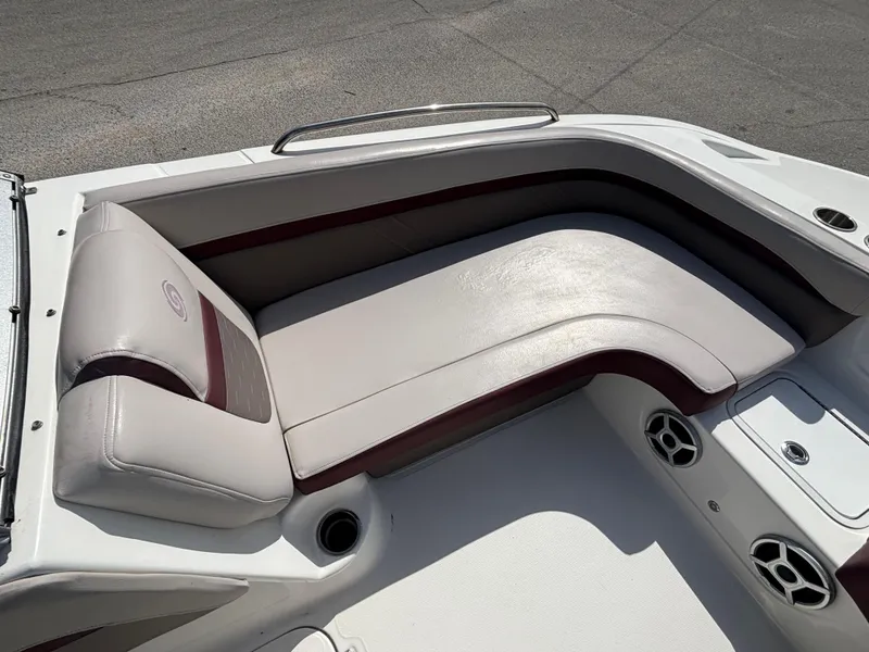 Slide: The Image of 2019 Hurricane SD217 boat interior with cushioned seating and cup holders. - 28