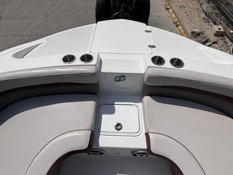 Slide: The Image of 2019 Hurricane SD217 boat interior with cushioned seating and cup holders. - 30