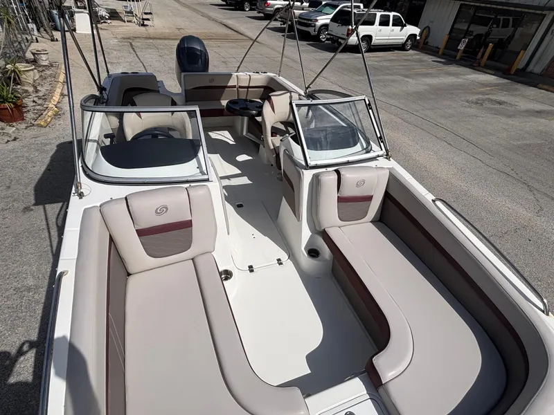 Slide: The Image of 2019 Hurricane SD217 boat with spacious seating and sleek design, parked outdoors. - 33