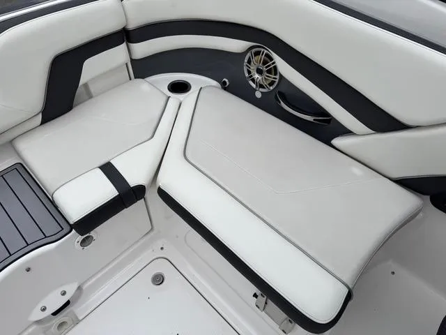 Slide: The Image of Luxurious seating on 2016 Yamaha Boats 242 Limited S with sleek design and speaker detail. - 10