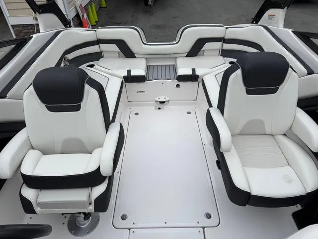 Slide: The Image of 2016 Yamaha Boats 242 Limited S interior with dual captain's chairs and sleek design. - 15