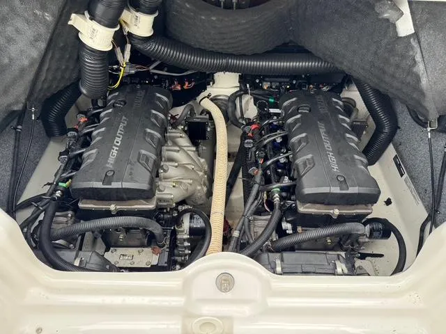 Slide: The Image of 2016 Yamaha Boats 242 Limited S engine compartment with dual high-output engines. - 8