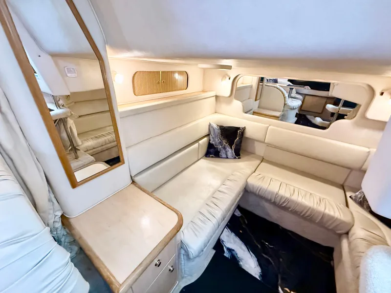 Slide: The Image of Luxurious interior of 1999 Sea Ray 340 Sundancer yacht with plush seating and elegant decor. - 24