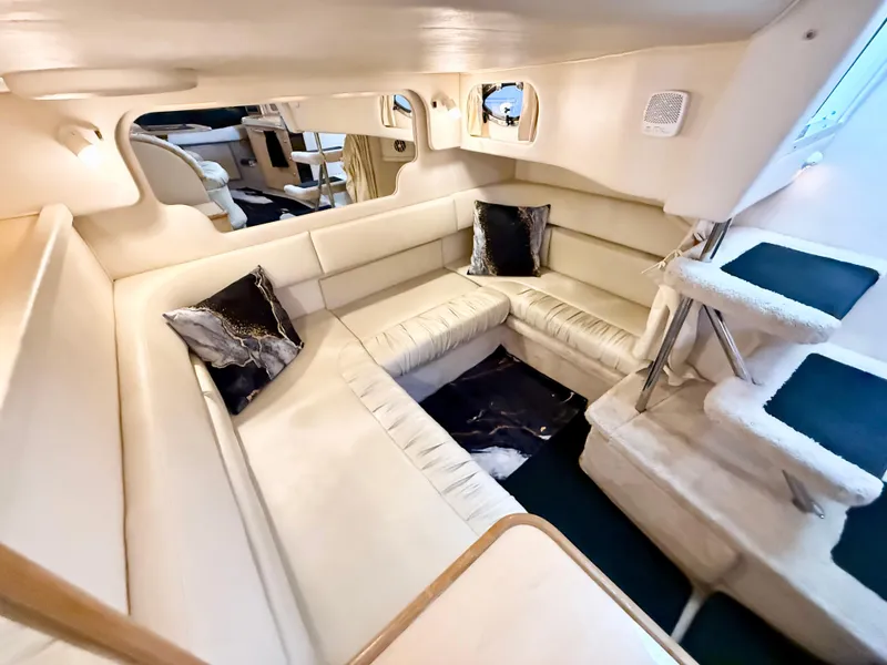 Slide: The Image of Luxurious interior of 1999 Sea Ray 340 Sundancer yacht with plush seating and elegant design. - 25