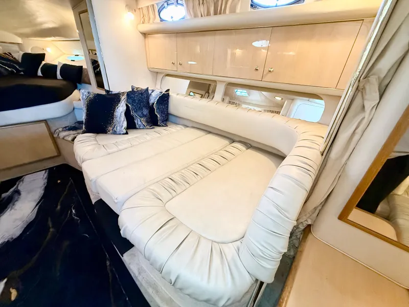 Slide: The Image of Luxurious interior of 1999 Sea Ray 340 Sundancer yacht with plush seating and elegant decor. - 29