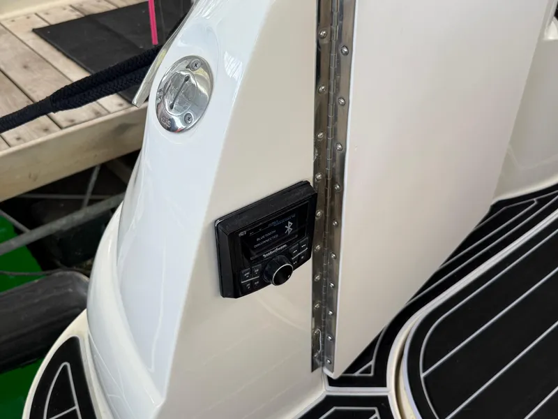 Slide: The Image of 1999 Sea Ray 340 Sundancer boat detail with control panel and sleek black flooring. - 30