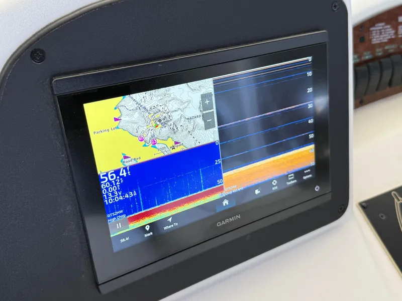 Slide: The Image of Garmin navigation display on 1999 Sea Ray 340 Sundancer boat, showing map and sonar data. - 31