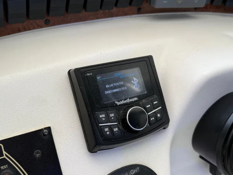 Slide: The Image of Control panel of a 1999 Sea Ray 340 Sundancer showing Bluetooth disconnected. - 32