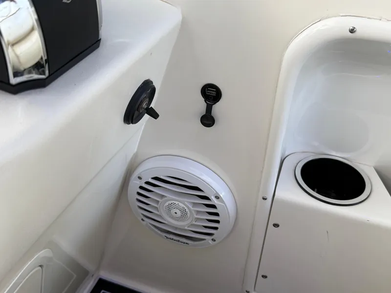 Slide: The Image of 1999 Sea Ray 340 Sundancer interior with speaker and cup holder. - 34