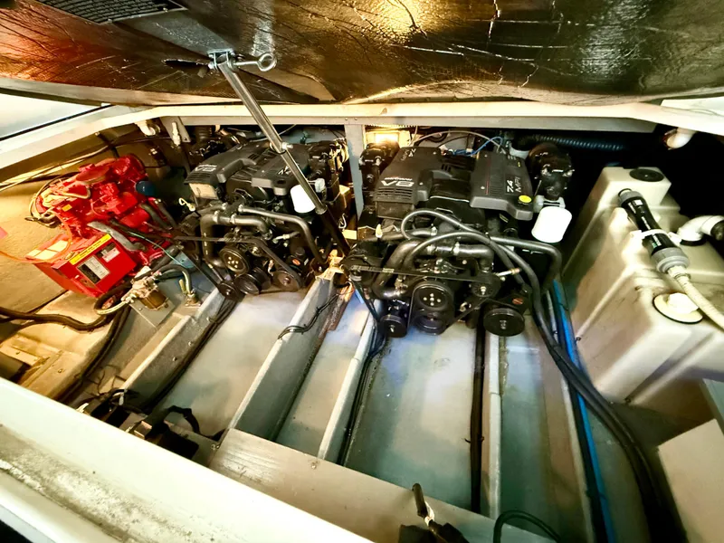 Slide: The Image of Engine room of a 1999 Sea Ray 340 Sundancer with dual engines and equipment. - 36