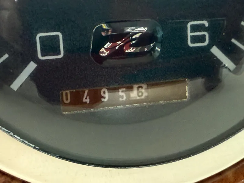 Slide: The Image of Close-up of a 1999 Sea Ray 340 Sundancer boat gauge displaying 4956 hours. - 42
