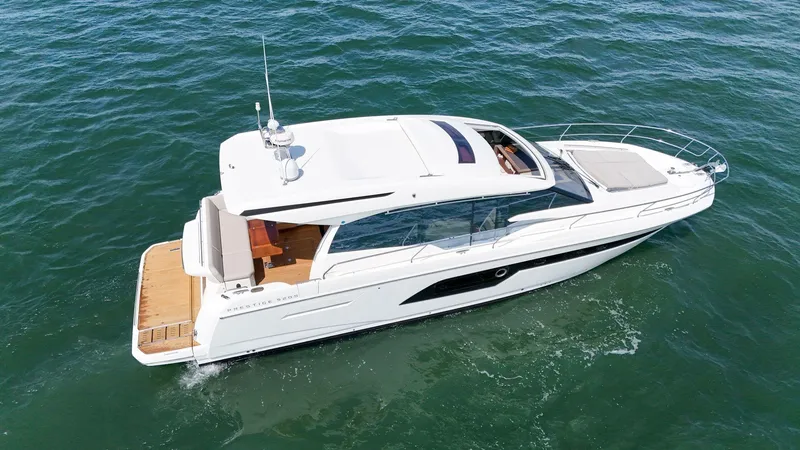 Slide: The Image of 2019 Prestige 520S yacht cruising on open water, showcasing sleek design and luxury features. - 16